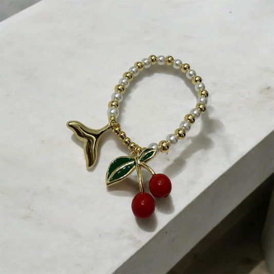 CHER_pulsera_de_perlita_con_cuentas_en_oro_laminado_cherry_corte_sirena_130_1